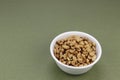 Round White Bowl Filled with Dry Roasted Salted Peanuts Snack Royalty Free Stock Photo