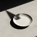 A round, white ceramic plate sits Royalty Free Stock Photo