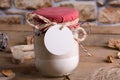 The Round white gift tag mockup on a jar with mixture of ingredients for baking cookies for Christmas Royalty Free Stock Photo