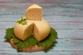 Round white homemade goat's milk cheese on wooden board Royalty Free Stock Photo