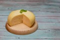 Round white homemade goat's milk cheese on wooden board Royalty Free Stock Photo