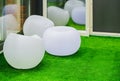 Round white modern furniture chairs. Spherical plastic chairs in recreation room