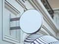 Round white signboard on the old building. 3d rendering