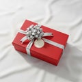A round white tag is attached beneath the bow creating a festive presentation Royalty Free Stock Photo