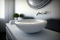 round white washbasin with silver faucet in sleek and modern bathroom