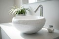 round white washbasin with silver faucet in sleek and modern bathroom