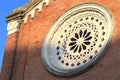 Round window on red brick wall in italian architecture Royalty Free Stock Photo