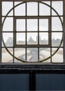 Round window, art deco design overlooking the train platform.