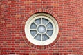 Round window in brick tower Royalty Free Stock Photo