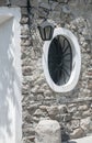 Round window on stone house Royalty Free Stock Photo