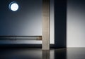 A round window on the left lets in soft light, casting geometric shadows Royalty Free Stock Photo