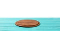 Round wood pizza cutting board on blue wooden table isolated on white background. Top view and copy space, Empty and template Royalty Free Stock Photo