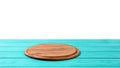 Round wood pizza cutting board on blue wooden table isolated on white background. Top view and copy space, Empty and template Royalty Free Stock Photo