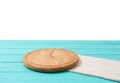 Round wood pizza cutting board and tablecloth on blue wooden table isolated on white background. Top view and copy space, Empty Royalty Free Stock Photo