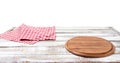 Round wood pizza cutting board and tablecloth on wooden table isolated on white background. Top view and copy space, Empty and Royalty Free Stock Photo