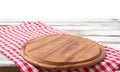 Round wood pizza cutting board and tablecloth on wooden table isolated on white background. Top view and copy space, Empty and Royalty Free Stock Photo