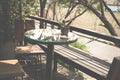 round wood table on terrace of house. wicker rattan chair on pat Royalty Free Stock Photo