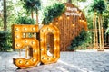 Round wooden arch, photo zone for a photo shoot for a 50th anniversary man