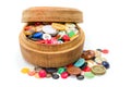 Round wooden box with colorful buttons