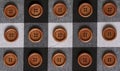 Round wooden brown sewing buttons isolated on textile background. Royalty Free Stock Photo