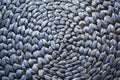Round woven mat texture background in silver blue