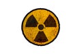 Round yellow and black radioactive ionizing radiation nuclear danger symbol on rusty metal grungy texture