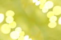 Round yellow light bokeh on green background. Blurred nature. Royalty Free Stock Photo
