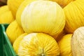 Round yellow melons on the counter. Healthy eating and vegetarianism. Close-up Royalty Free Stock Photo