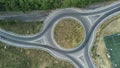 Roundabout, aerial view. Road infrastructure. Sunny summer day. View vertically from top to bottom