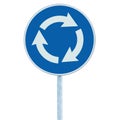 Roundabout crossroad road sign isolated, blue, white arrows left hand, roadside traffic signage vertical closeup Royalty Free Stock Photo