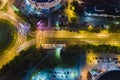 Roundabout intersection. road traffic with car light trails. aerial top view at night Royalty Free Stock Photo