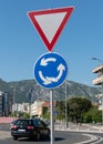 Roundabout or rotary sign below give way or yield sign Royalty Free Stock Photo