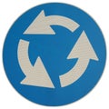 Roundabout sign isolated over white Royalty Free Stock Photo
