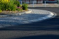 Roundabout with a spotted perennial plantation that blooms and attracts insects. resembles a meadow. The center of the circle is f