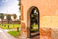 Rounded cloister entry on brick wall Royalty Free Stock Photo