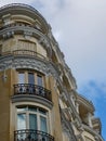 Rounded corner of classy baroque house downtown in Madrid, Spain. Elegant vintage Spanish classical architecture