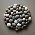 Rounded pebbles is arranged in a circular formation against a Royalty Free Stock Photo