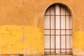 Rounded Window with red iron grate Royalty Free Stock Photo