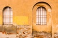 Rounded Windows with red iron grate Royalty Free Stock Photo