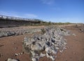 A roundly eroded light grey rock formation on the Sandy Beach near Easthaven. Royalty Free Stock Photo