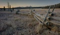 Wood pole fence and Sawtooth mountains on a frosty morning