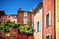 Roussillon: A narrow street in the beautiful French village of Roussillon, where the buildings are made with colorful, France Royalty Free Stock Photo