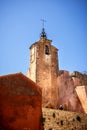 Roussillon: A narrow street in the beautiful French village of Roussillon, where the buildings are made with colorful, France Royalty Free Stock Photo