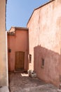 Roussillon ochre coloured alley village house buildings in France