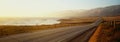 This is Route 1also known as the Pacific Coast Highway. The road is situated next to the ocean with the mountains in the Royalty Free Stock Photo