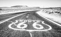 Route 66 cracked sign on hot asphalt