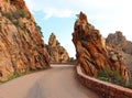 route D81 snaked along the Corsican coast a ribbon of asphalt clinging to the rugged cliffs Royalty Free Stock Photo