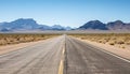 Route 66 highway road at midday clear sky desert mountains background landscape Royalty Free Stock Photo