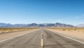 Route 66 highway road at midday clear sky desert mountains background landscape Royalty Free Stock Photo