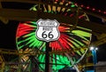 Route 66 Sign and Pacific Wheel at Night